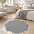 Striped Modern Round Kitchen Rug – Gray in a bedroom